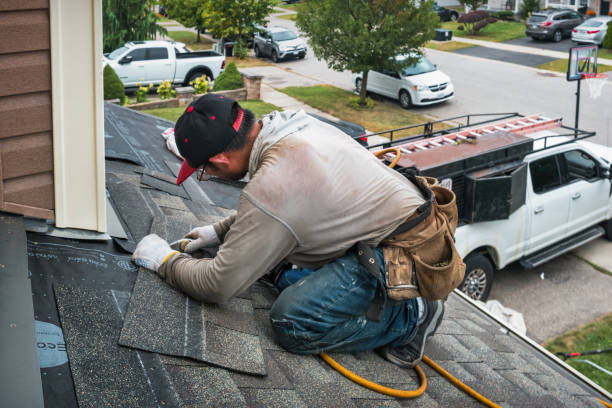 Professional Roofing technician working in Towson, MD